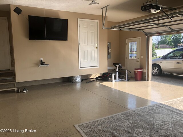 149 Wood Gate Dr, Mt Washington, KY 40047 - garage featuring a garage door opener