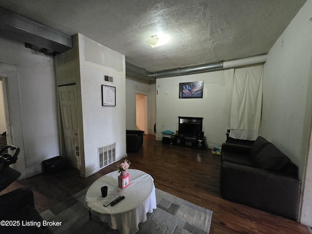 2426 Rowan St, Louisville, KY 40212 - living room with wood finished floors and a textured ceiling