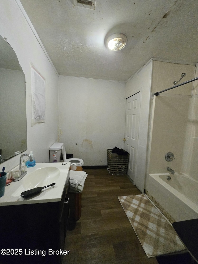 2426 Rowan St, Louisville, KY 40212 - bathroom featuring vanity, wood finished floors, and washtub / shower combination