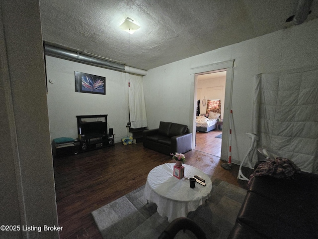 2426 Rowan St, Louisville, KY 40212 - living room featuring wood finished floors and a textured ceiling