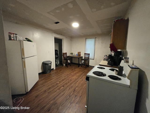 2426 Rowan St, Louisville, KY 40212 - kitchen featuring white appliances and dark wood finished floors