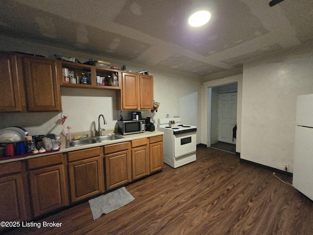 2426 Rowan St, Louisville, KY 40212 - kitchen featuring white appliances, dark wood-style flooring, light countertops, brown cabinets, and open shelves