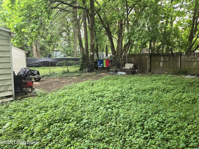 2426 Rowan St, Louisville, KY 40212 - fenced backyard with an outdoor structure