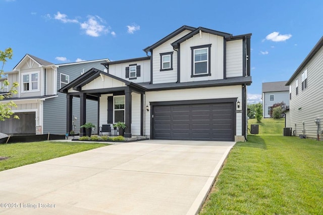 19136 Catalpa Fields Pl, Louisville, KY 40023 - view of front facade featuring board and batten siding, a garage, a front yard, and concrete driveway