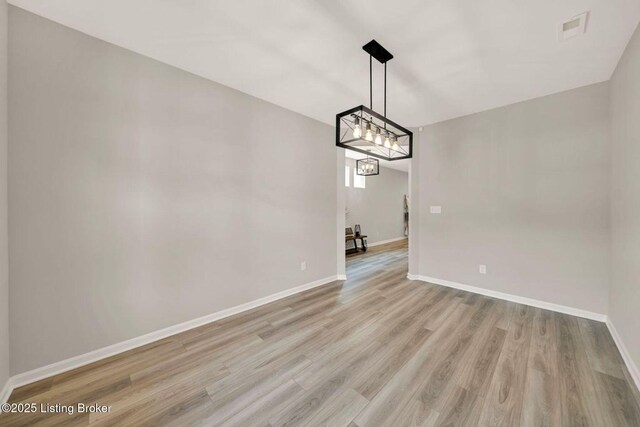 19136 Catalpa Fields Pl, Louisville, KY 40023 - unfurnished dining area featuring light wood-style flooring and baseboards