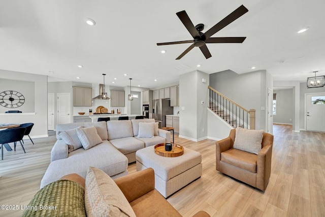 19136 Catalpa Fields Pl, Louisville, KY 40023 - living room featuring stairway, light wood-style floors, recessed lighting, and a ceiling fan