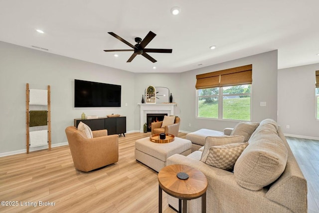 19136 Catalpa Fields Pl, Louisville, KY 40023 - living room featuring light wood-style floors, ceiling fan, recessed lighting, and a glass covered fireplace
