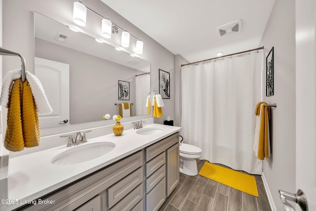 19136 Catalpa Fields Pl, Louisville, KY 40023 - bathroom featuring double vanity, wood tiled floors, and a shower with curtain