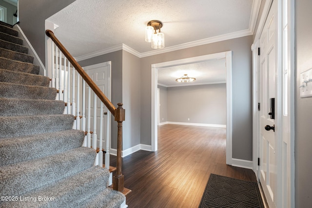 3627 E Locust Cir, Prospect, KY 40059 - entrance foyer with stairs, wood finished floors, a textured ceiling, and crown molding