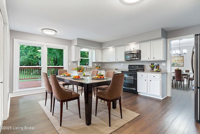 3627 E Locust Cir, Prospect, KY 40059 - dining space featuring a chandelier and dark wood finished floors
