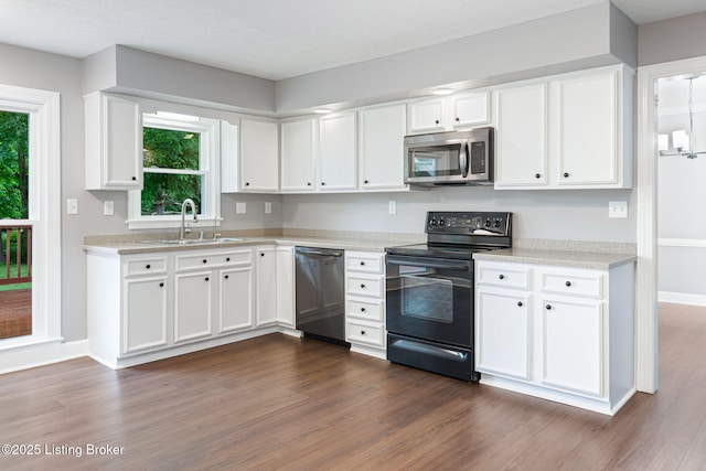 3627 E Locust Cir, Prospect, KY 40059 - kitchen featuring appliances with stainless steel finishes, dark wood finished floors, light countertops, and white cabinetry