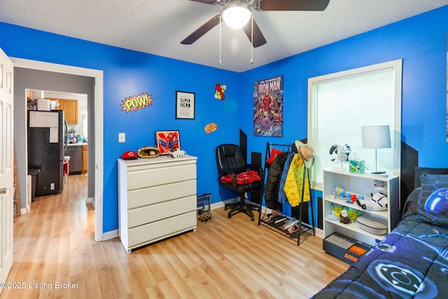 703 Cheri Way, Fairdale, KY 40118 - bedroom featuring wood finished floors, freestanding refrigerator, and a ceiling fan