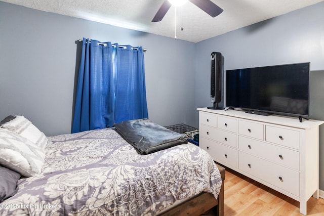 703 Cheri Way, Fairdale, KY 40118 - bedroom featuring light wood finished floors, a textured ceiling, and a ceiling fan