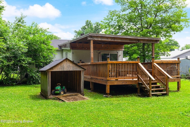 703 Cheri Way, Fairdale, KY 40118 - rear view of property with a wooden deck, a storage unit, and a lawn