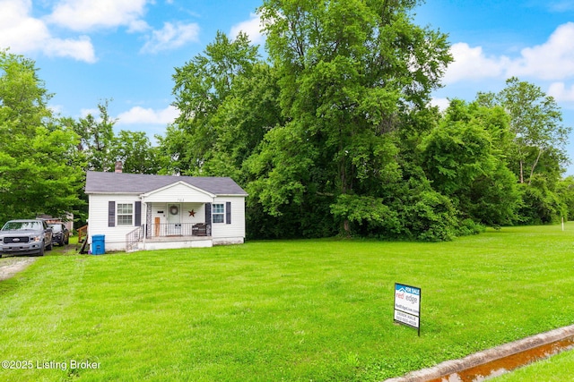 703 Cheri Way, Fairdale, KY 40118 - view of front of home featuring a porch, a front yard, and a chimney