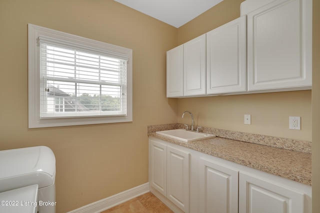 3509 Sasse Way, Louisville, KY 40245 - laundry area with cabinet space and baseboards