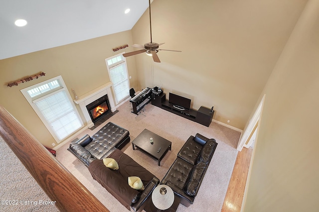 3509 Sasse Way, Louisville, KY 40245 - carpeted living area featuring a towering ceiling, a fireplace with flush hearth, ceiling fan, and recessed lighting