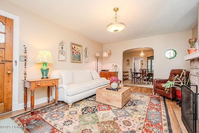 114 S Crestmoor Ave, Louisville, KY 40206 - living room featuring arched walkways and light wood-type flooring