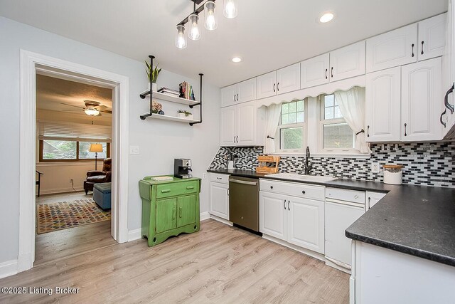 114 S Crestmoor Ave, Louisville, KY 40206 - kitchen with stainless steel dishwasher, dark countertops, white cabinetry, light wood-style flooring, and recessed lighting