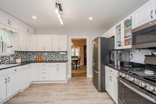 114 S Crestmoor Ave, Louisville, KY 40206 - kitchen with stainless steel appliances, glass insert cabinets, white cabinets, light wood-style flooring, and recessed lighting