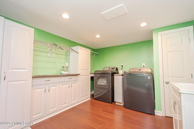 114 S Crestmoor Ave, Louisville, KY 40206 - washroom featuring washing machine and clothes dryer, light wood-style flooring, cabinet space, and recessed lighting