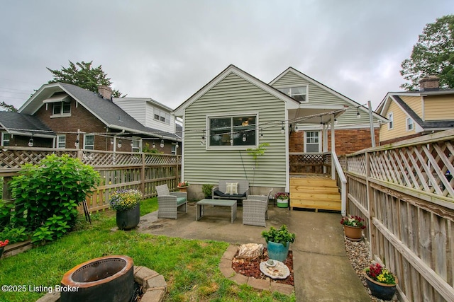 114 S Crestmoor Ave, Louisville, KY 40206 - rear view of property featuring a fenced backyard, a patio area, a deck, and an outdoor living space with a fire pit