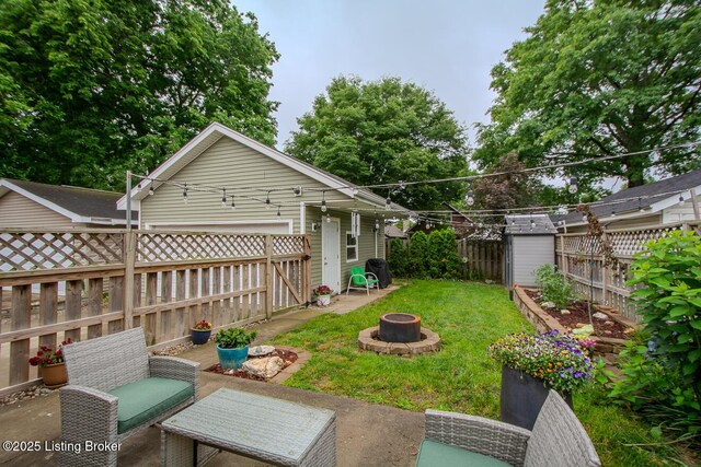 114 S Crestmoor Ave, Louisville, KY 40206 - fenced backyard with a fire pit and a patio