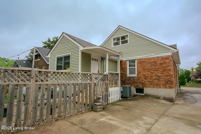 114 S Crestmoor Ave, Louisville, KY 40206 - rear view of property featuring brick siding and a patio