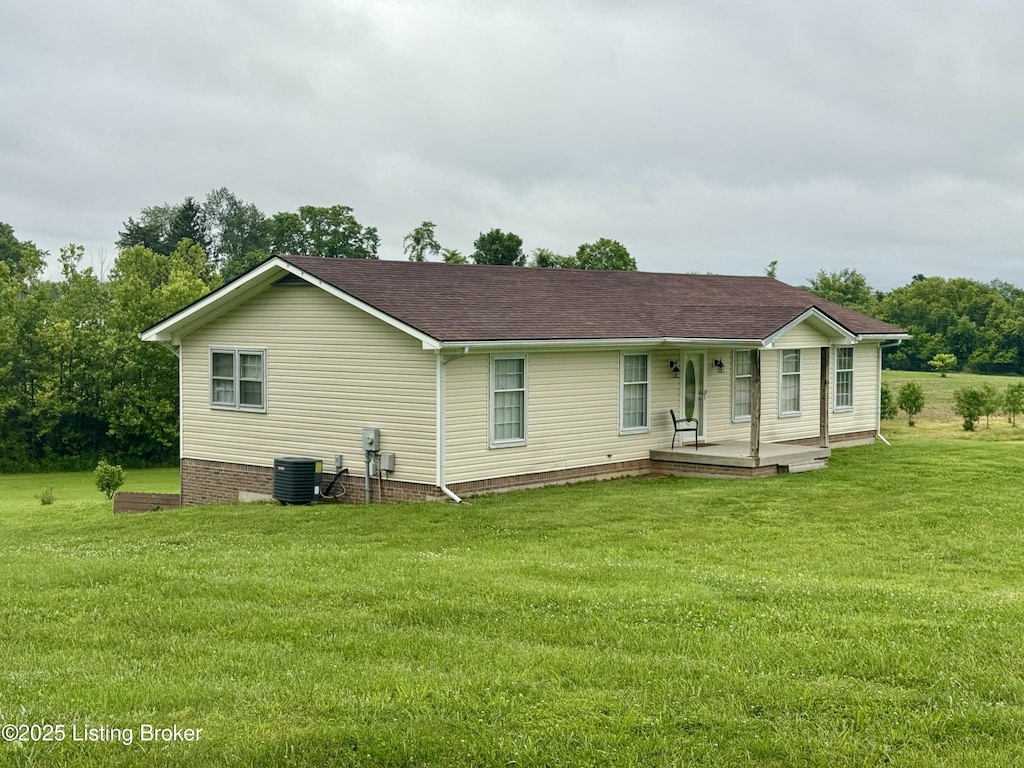301 Minors Ln, Coxs Creek, KY 40013 - back of house featuring a porch, a lawn, and roof with shingles