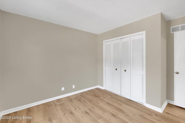 1123 Meadowridge Trl, Goshen, KY 40026 - unfurnished bedroom featuring light wood finished floors and a closet