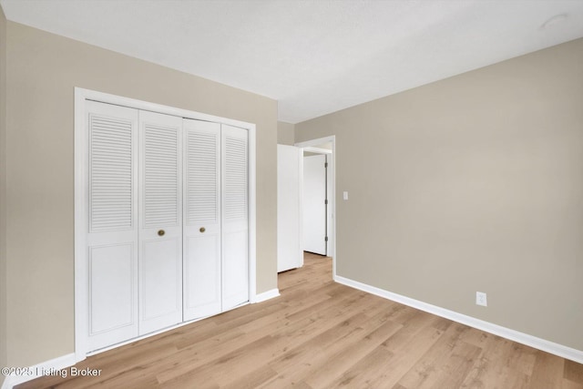 1123 Meadowridge Trl, Goshen, KY 40026 - unfurnished bedroom with light wood-type flooring and a closet