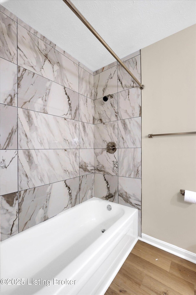 1123 Meadowridge Trl, Goshen, KY 40026 - bathroom with wood finished floors, shower / bathtub combination, and a textured ceiling