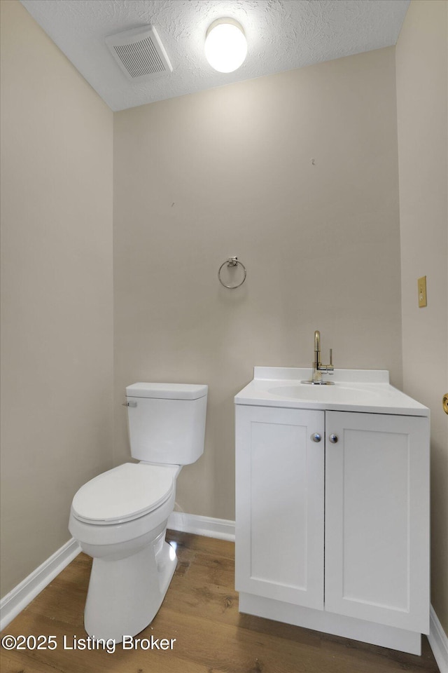 1123 Meadowridge Trl, Goshen, KY 40026 - half bathroom with wood finished floors, vanity, and a textured ceiling