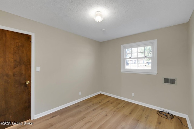1123 Meadowridge Trl, Goshen, KY 40026 - empty room featuring wood finished floors and a textured ceiling