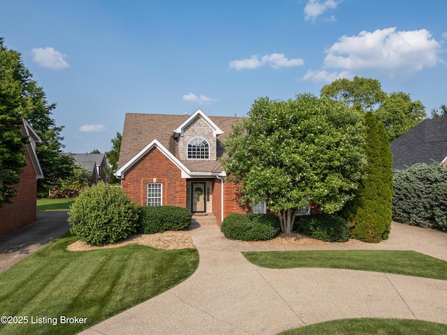 6205 Elizabeth Ct, Prospect, KY 40059 - view of front of house with brick siding, a shingled roof, and a front lawn