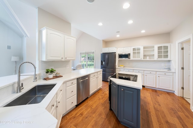 6205 Elizabeth Ct, Prospect, KY 40059 - kitchen featuring appliances with stainless steel finishes, white cabinetry, glass insert cabinets, light wood-style flooring, and recessed lighting