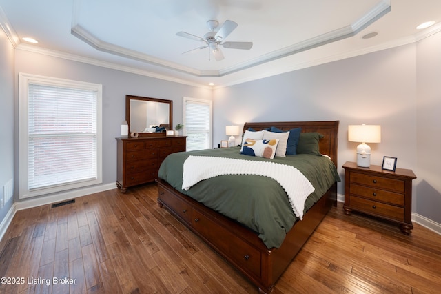 6205 Elizabeth Ct, Prospect, KY 40059 - bedroom featuring a tray ceiling, multiple windows, hardwood / wood-style floors, and ornamental molding
