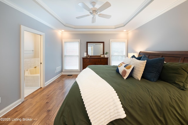 6205 Elizabeth Ct, Prospect, KY 40059 - bedroom with a raised ceiling, multiple windows, light wood finished floors, ensuite bath, and ornamental molding