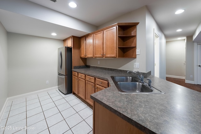 6205 Elizabeth Ct, Prospect, KY 40059 - kitchen with freestanding refrigerator, open shelves, dark countertops, brown cabinetry, and recessed lighting