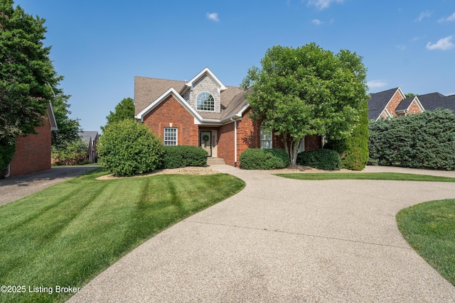 6205 Elizabeth Ct, Prospect, KY 40059 - view of front of home with brick siding, a front lawn, driveway, and a shingled roof