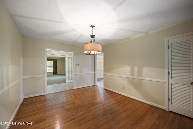 6704 Hollow Tree Rd, Louisville, KY 40228 - spare room featuring wood finished floors and a chandelier