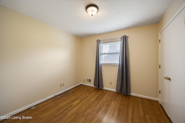 6704 Hollow Tree Rd, Louisville, KY 40228 - unfurnished room with wood finished floors and baseboards