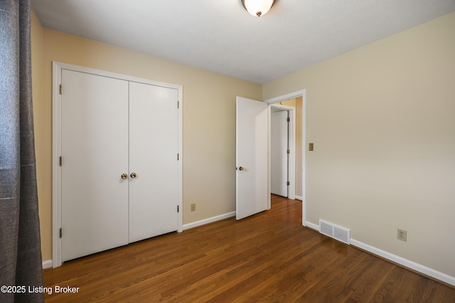 6704 Hollow Tree Rd, Louisville, KY 40228 - unfurnished bedroom with wood finished floors and a closet