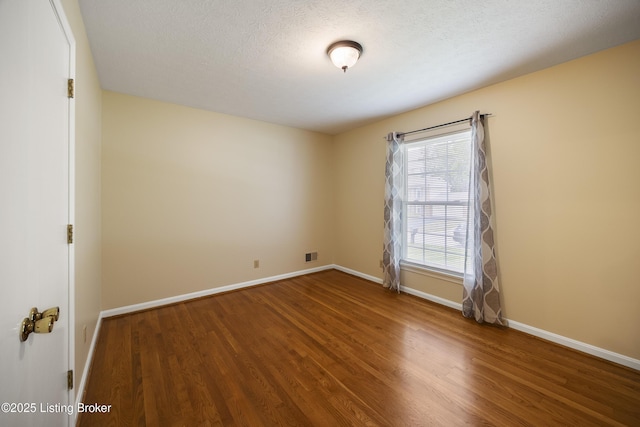 6704 Hollow Tree Rd, Louisville, KY 40228 - empty room featuring wood finished floors and baseboards