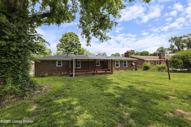 6704 Hollow Tree Rd, Louisville, KY 40228 - rear view of house with brick siding, a lawn, a chimney, and a patio area
