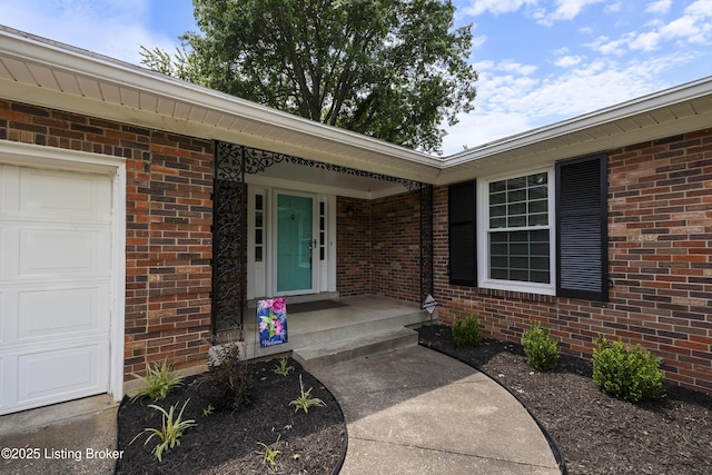 6704 Hollow Tree Rd, Louisville, KY 40228 - property entrance with a garage and brick siding