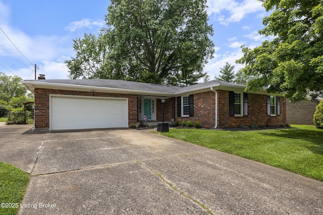 6704 Hollow Tree Rd, Louisville, KY 40228 - view of front of home with driveway, a garage, a front yard, and brick siding