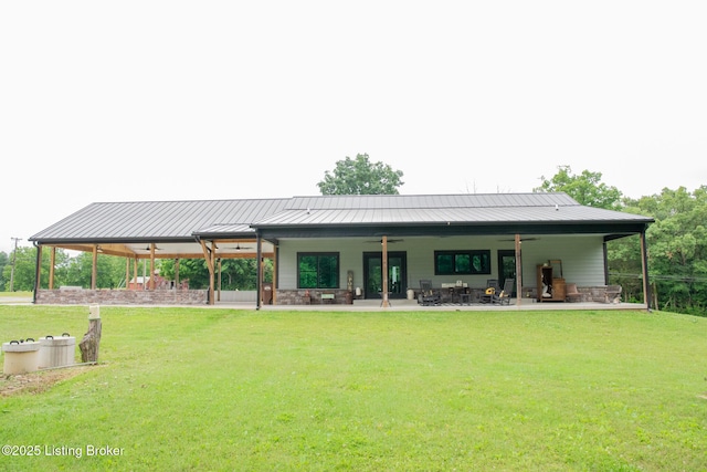 9115 Independence School Rd, Louisville, KY 40228 - back of house featuring ceiling fan, a yard, a patio, and a standing seam roof