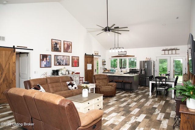 9115 Independence School Rd, Louisville, KY 40228 - living room featuring a barn door, high vaulted ceiling, ceiling fan, and wood finished floors