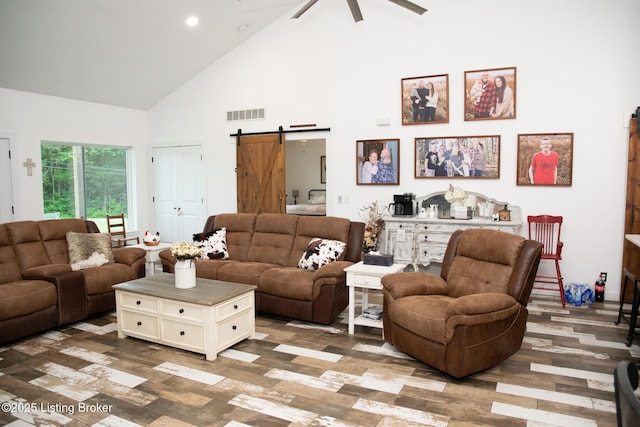 9115 Independence School Rd, Louisville, KY 40228 - living room with a barn door, high vaulted ceiling, ceiling fan, wood finished floors, and recessed lighting